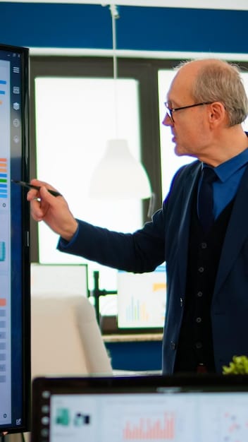 An image showing a startup founder presenting a compelling pitch deck to a panel of venture capitalists, emphasizing key metrics and growth projections on a large screen.