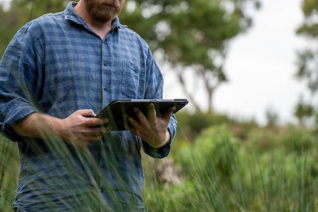 A farmer using a tablet to monitor real-time data from sensors in the field, illustrating the integration of technology in modern farming practices.