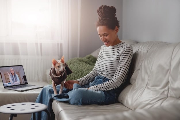 A pet owner using a laptop to video call a veterinarian, with their cat sitting comfortably beside them. The setting is a cozy living room, emphasizing the convenience of telehealth services.