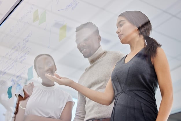 A modern workspace with diverse professionals brainstorming ideas on a whiteboard, reflecting the collaborative environment of a digital health startup focused on developing innovative solutions for patient care.