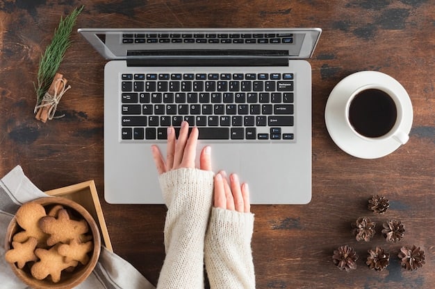 A close-up shot of a person's hands using a laptop on a wooden desk with a coffee mug and a notepad in the background. The focus is on the laptop screen, which displays a tech review article.