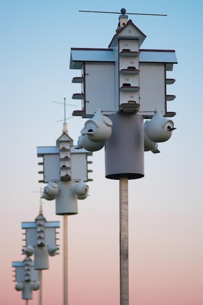 A close-up of a high-tech air quality sensor installed on a lamppost in a suburban US neighborhood, displaying real-time pollution levels on a digital screen.
