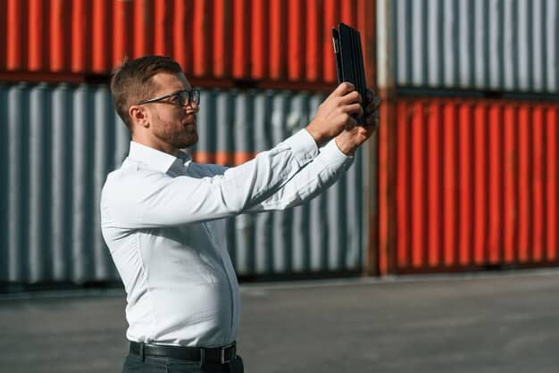 A close-up shot of a customs officer inspecting goods at a port, with shipping containers visible in the background, emphasizing the role of tariffs in international trade.