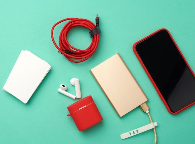 An overhead shot of the Anker PowerCore 3 charging multiple devices simultaneously, including a smartphone and wireless earbuds, highlighting its multi-device charging capability and compact design.