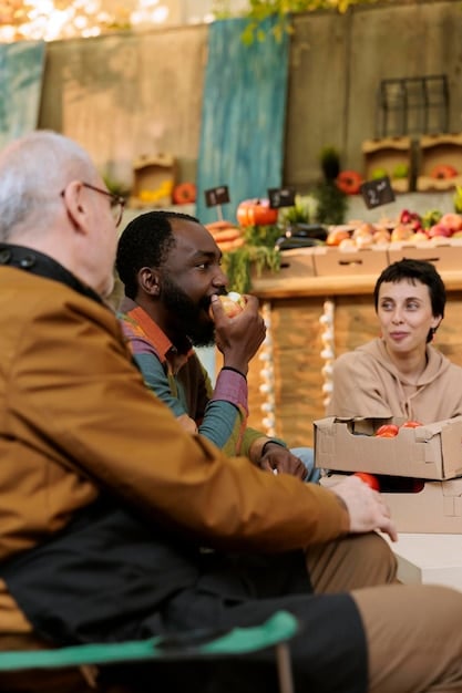 A diverse group of people, from different age groups and backgrounds, trying small samples of cultivated meat at a food fair, demonstrating consumer interaction and curiosity.
