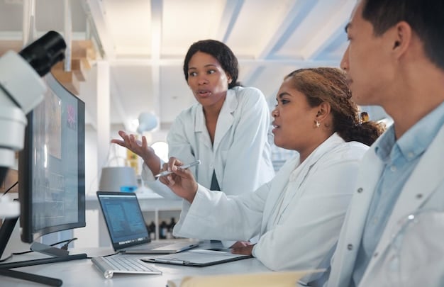 A diverse team of scientists in a modern lab setting, some looking at microscope slides, others at data on screens, symbolizing collaborative research in addressing the challenges of nanomedicine.