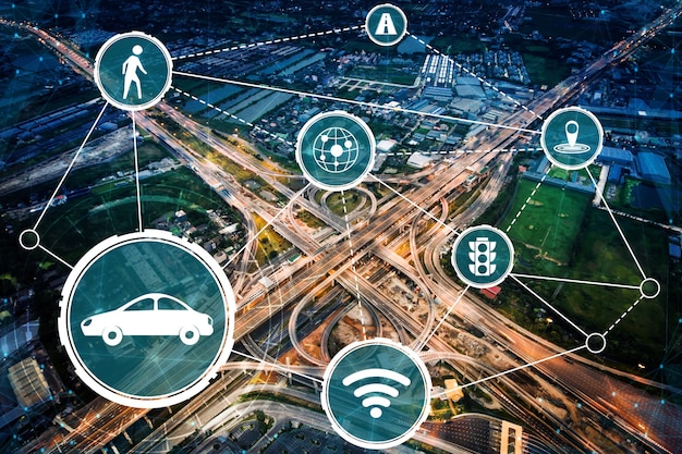A detailed schematic showing how a connected car (autonomous vehicle) communicates with road infrastructure, traffic lights, and other vehicles through a 5G network.